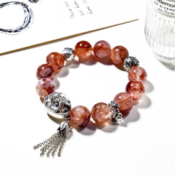Original designed red rutilated quartz crystal bead bracelet, a niche and high-end piece with color-preserving alloy accessories and tassels, red crystal bracelet